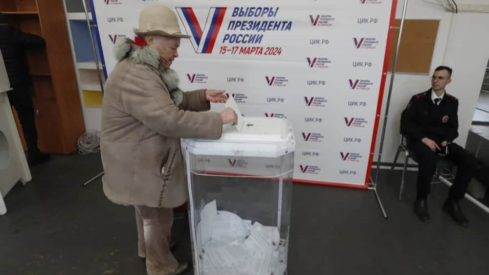 A woman casts her ballot during the presidential election in Moscow last Friday. Photo: EPA-EFE/MAXIM SHIPENKOV
