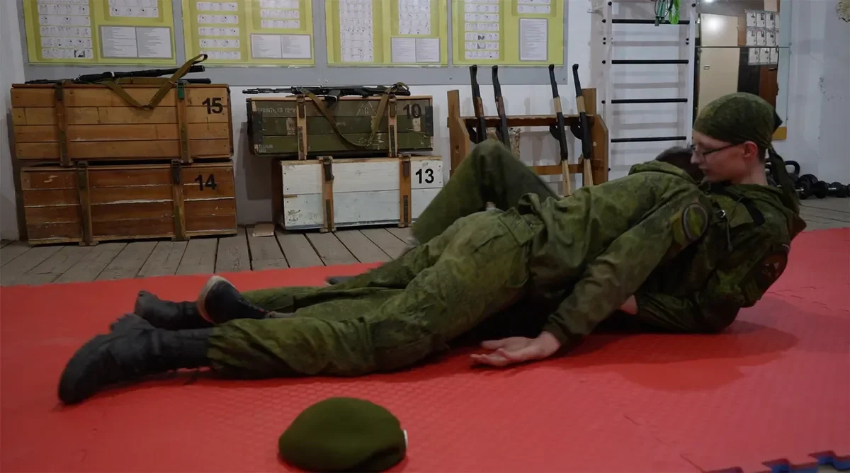 Schoolchildren in the classroom at the Sarma club are practicing the evacuation of the bodies of the dead. A shot from the film “Firewood for the mobilised”