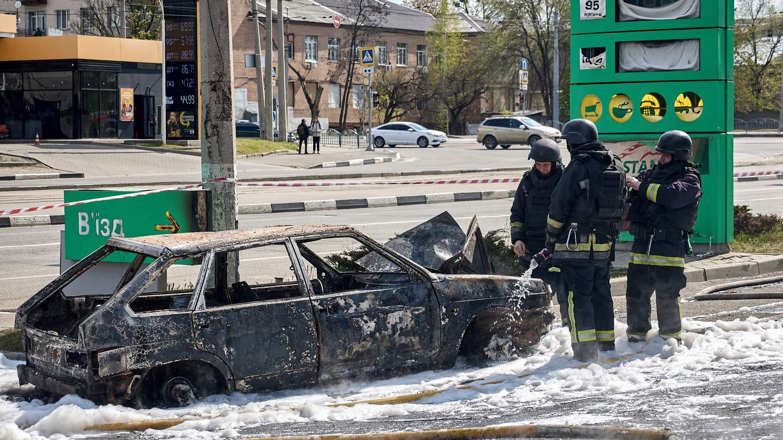 Ukrainian first responders extinguish a fire that broke out after a Russian drone strike on a petrol station in Kharkiv, Ukraine, 2 May 2026. Photo: EPA / SERGEY KOZLOV