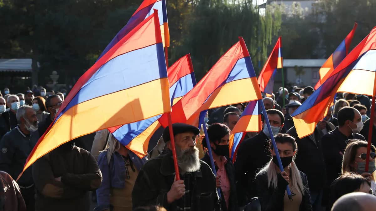 Protesters flying the Armenian flag at an opposition rally in Yerevan. Photo: EPA-EFE / STEPAN POGHOSYAVN /vPHOTOLURE