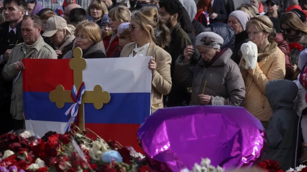 Mourners gather at victims’ memorial eight days after the Crocus City Hall attack. Photo: EPA-EFE/SERGEI ILNITSKY