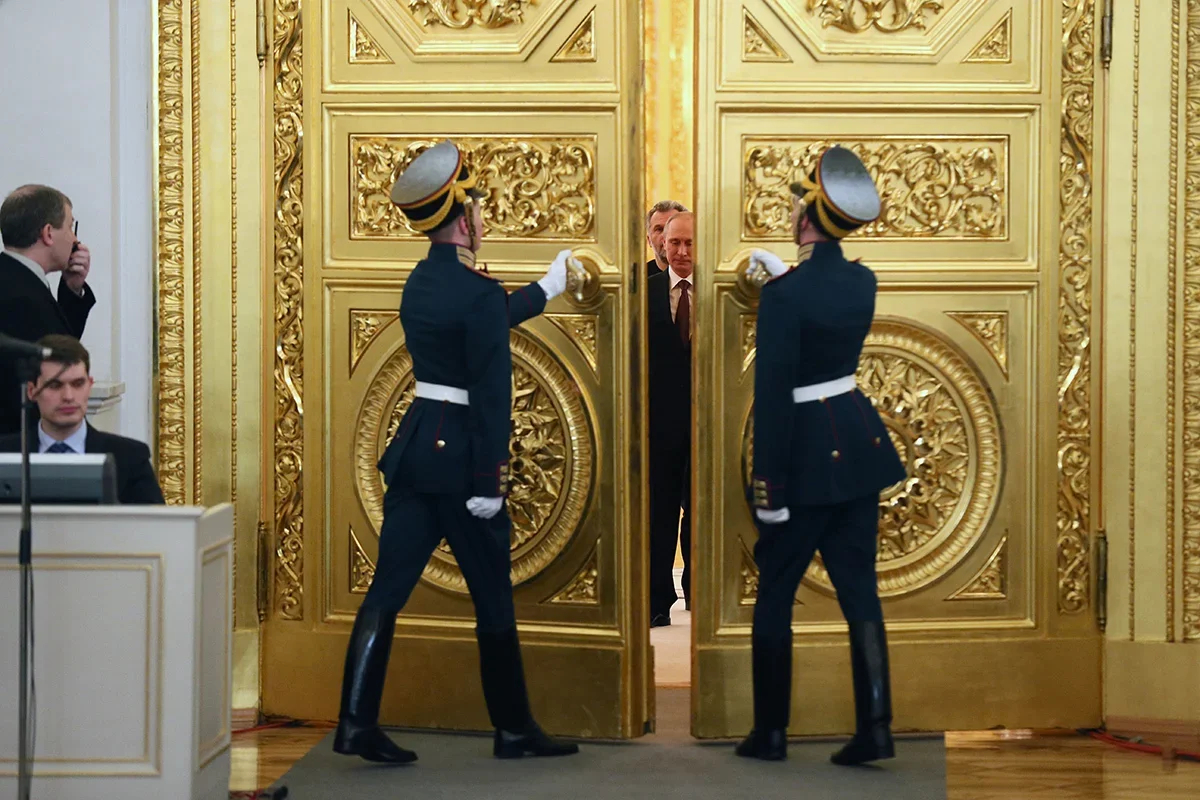 Vladimir Putin arrives to sign a treaty on Crimea’s “reunification” with Russia in the Kremlin, 18 March 2014. Photo: EPA/SERGEI ILNITSKY
