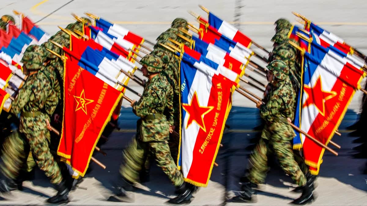 Serbian army soldiers march with war time flags during a military parade at the military airport Batajnica, near Belgrade, Serbia, 19 October 2019. Russian Prime Minister Dmitry Medvedev arrived on a one-day official visit to Serbia on the same day. EPA-EFE/SRDJAN SUKI